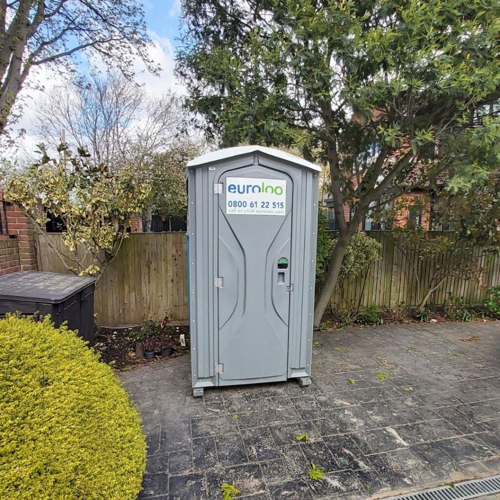 euroloo in the front drive of a home