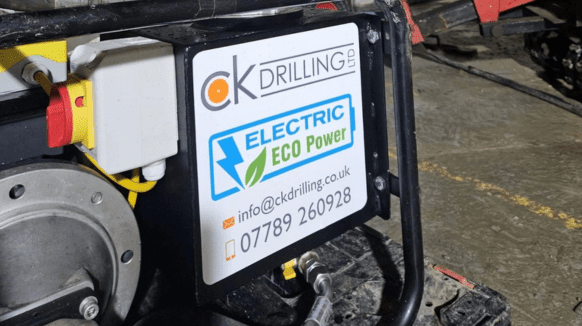 Completely Kompact Drilling Ltd signage on their drill