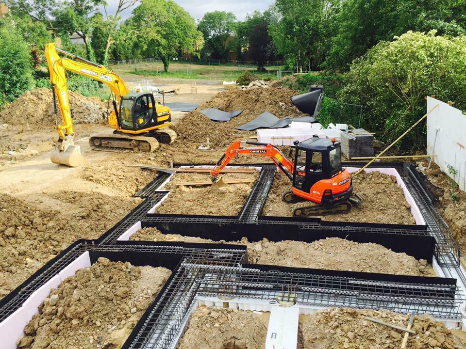 Goni Construction diggers in a garden